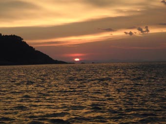 The sun setting at the anchorage
