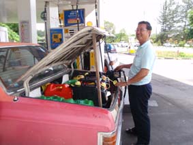 Simon, filling his boot with diesel for Hinewai